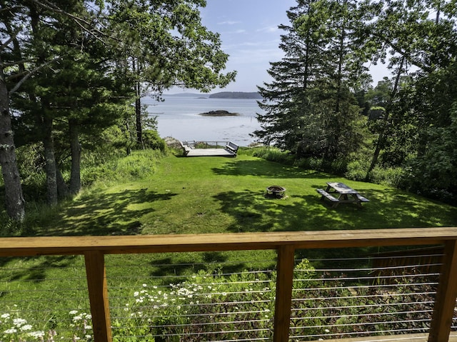 585 N Lubec Rd, Lubec, ME 04652 - view of grassy yard featuring a water view and an outdoor fire pit