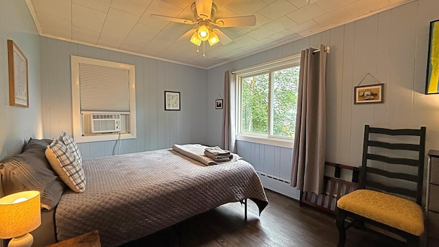 585 N Lubec Rd, Lubec, ME 04652 - bedroom featuring wood finished floors, cooling unit, ornamental molding, and a ceiling fan