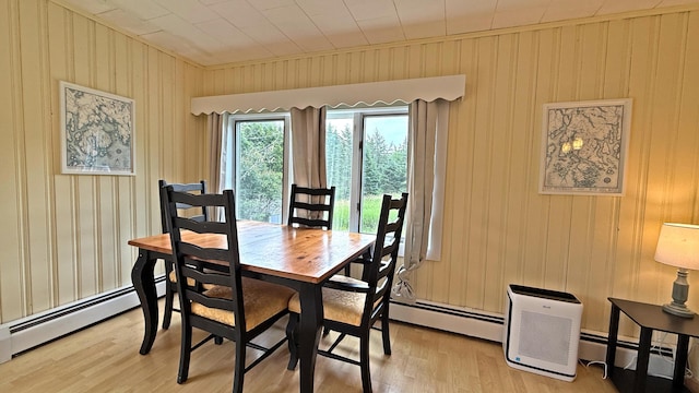 585 N Lubec Rd, Lubec, ME 04652 - dining area featuring a baseboard heating unit and light wood-style flooring