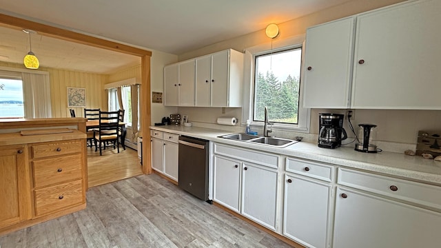 585 N Lubec Rd, Lubec, ME 04652 - kitchen with dishwasher, healthy amount of natural light, white cabinetry, and light countertops