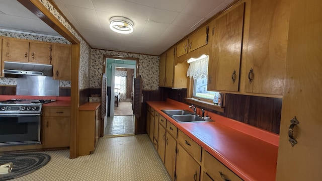 269 County Rd, Lubec, ME 04652 - kitchen with wallpapered walls, a wainscoted wall, plenty of natural light, stove, and under cabinet range hood
