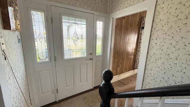 269 County Rd, Lubec, ME 04652 - entrance foyer with wallpapered walls and carpet floors