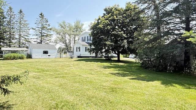 269 County Rd, Lubec, ME 04652 - view of green lawn with an outbuilding