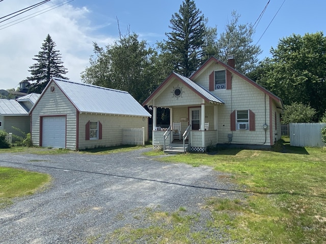 48 Dane Ave, Skowhegan, ME 04976 - view of front of house with a porch, a chimney, an outdoor structure, driveway, and cooling unit