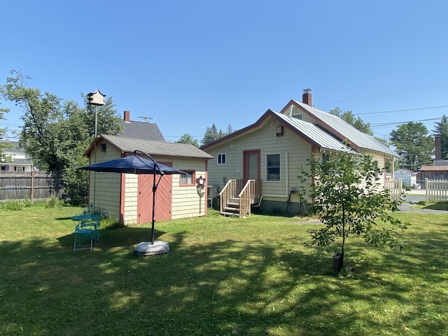 48 Dane Ave, Skowhegan, ME 04976 - back of property featuring a shed and a chimney