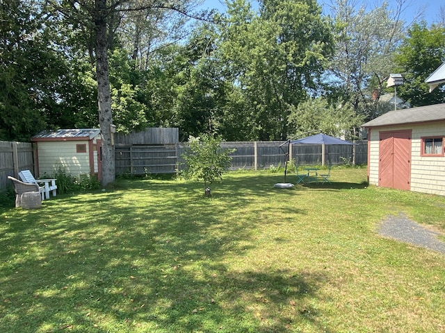 48 Dane Ave, Skowhegan, ME 04976 - fenced backyard with a storage unit