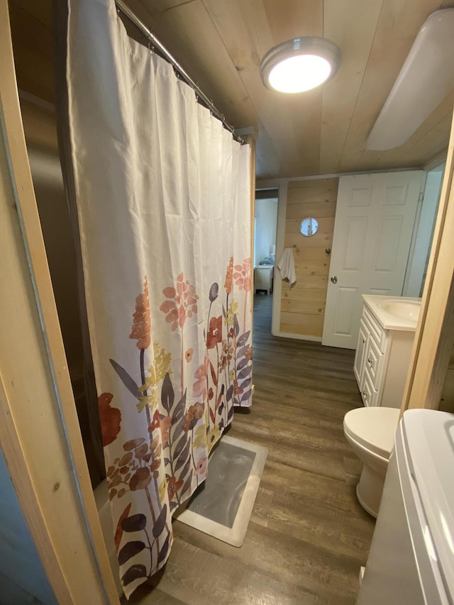 48 Dane Ave, Skowhegan, ME 04976 - bathroom with vanity, wood finished floors, and curtained shower