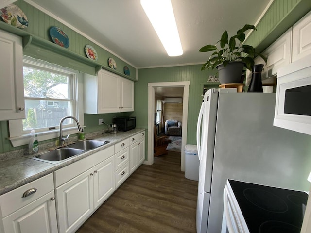 48 Dane Ave, Skowhegan, ME 04976 - kitchen featuring white microwave, crown molding, white cabinetry, dark wood-style floors, and electric range oven