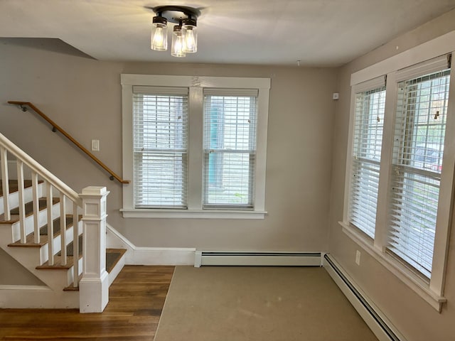 272 Center St, Bangor, ME 04401 - unfurnished dining area featuring a baseboard radiator and plenty of natural light