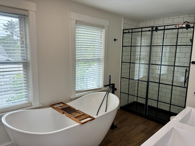 272 Center St, Bangor, ME 04401 - full bath with wood finished floors, a shower stall, and healthy amount of natural light