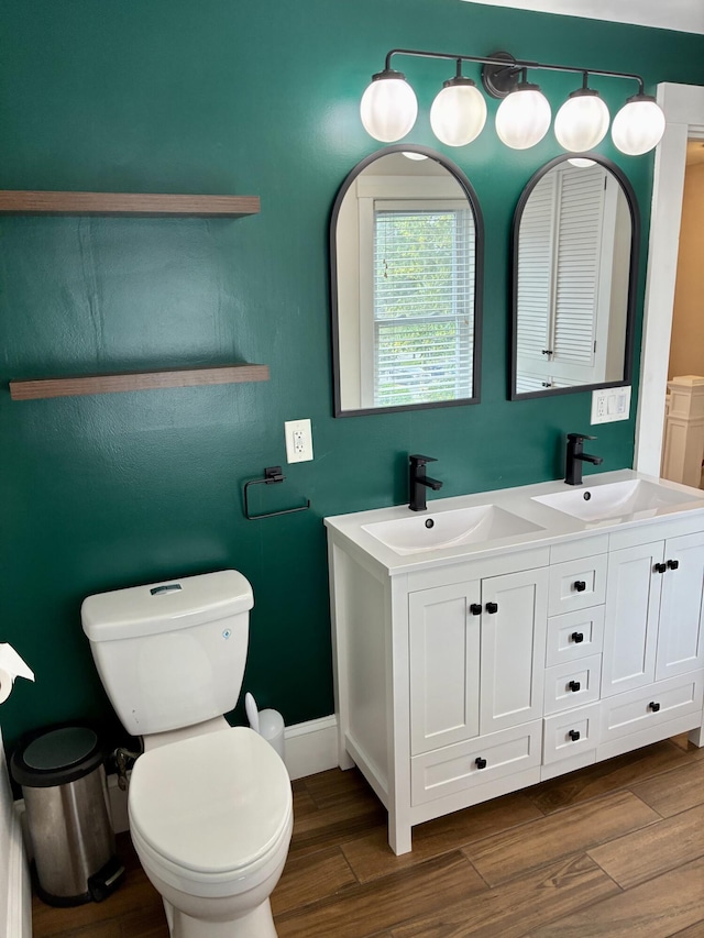 272 Center St, Bangor, ME 04401 - bathroom with wood finished floors and double vanity