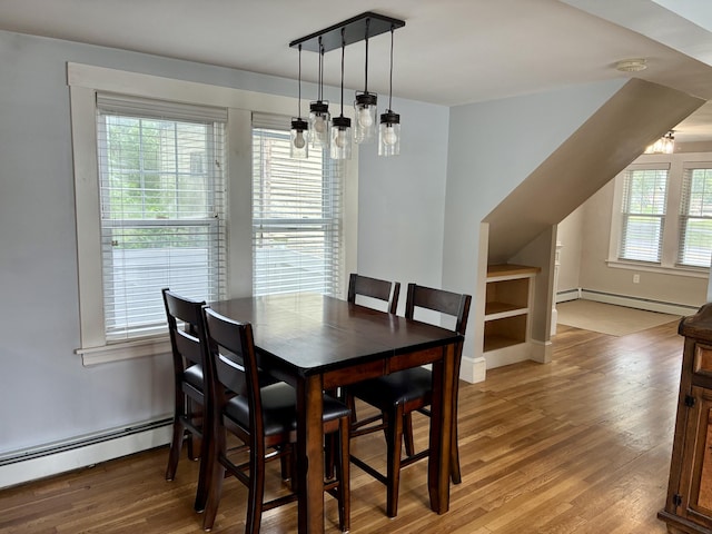 272 Center St, Bangor, ME 04401 - dining room featuring a baseboard radiator and light wood-type flooring
