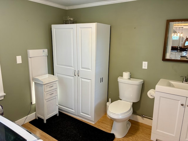 272 Center St, Bangor, ME 04401 - bathroom with vanity, wood finished floors, and ornamental molding