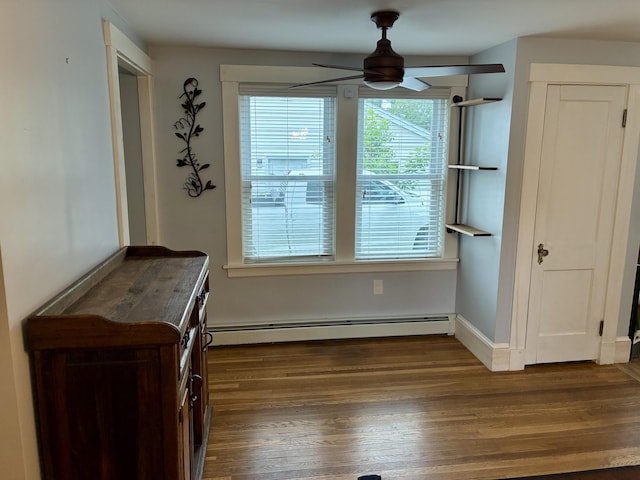 272 Center St, Bangor, ME 04401 - unfurnished dining area with ceiling fan, wood finished floors, and baseboard heating
