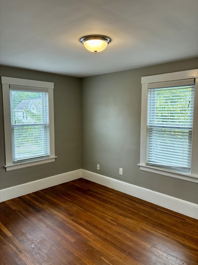 272 Center St, Bangor, ME 04401 - spare room featuring dark wood-style floors and baseboards