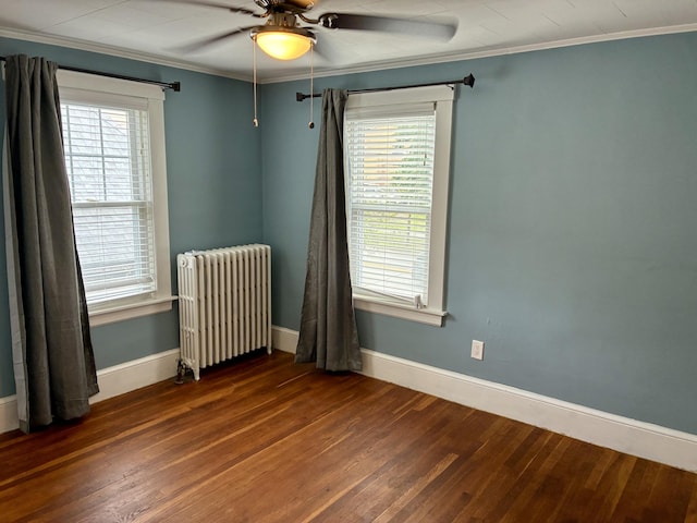 272 Center St, Bangor, ME 04401 - empty room with radiator heating unit, wood-type flooring, a ceiling fan, plenty of natural light, and crown molding