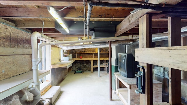 46 Crest Ave, Auburn, ME 04210 - unfinished basement featuring a workshop area