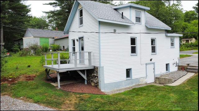 46 Crest Ave, Auburn, ME 04210 - rear view of house featuring a shingled roof and a lawn