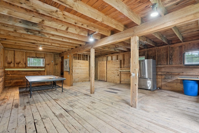 471 Methodist Rd, Westbrook, ME 04092 - basement with freestanding refrigerator, hardwood / wood-style flooring, wood ceiling, wood walls, and electric panel