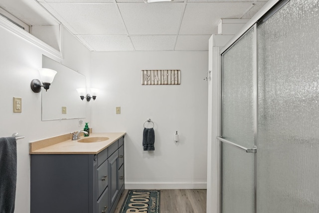 471 Methodist Rd, Westbrook, ME 04092 - full bathroom featuring vanity, wood finished floors, a shower stall, and a drop ceiling