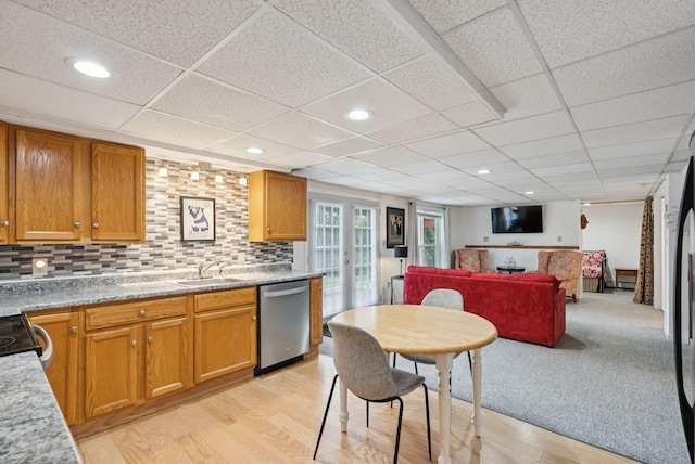 471 Methodist Rd, Westbrook, ME 04092 - kitchen featuring stainless steel dishwasher, light wood-type flooring, open floor plan, tasteful backsplash, and a drop ceiling