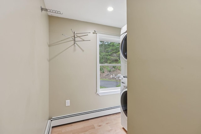 471 Methodist Rd, Westbrook, ME 04092 - laundry area with stacked washer / dryer, baseboard heating, light wood-style flooring, and recessed lighting