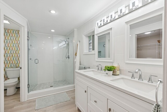 471 Methodist Rd, Westbrook, ME 04092 - full bathroom featuring a stall shower, wood finished floors, double vanity, crown molding, and recessed lighting