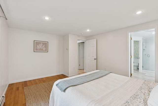 471 Methodist Rd, Westbrook, ME 04092 - bedroom featuring baseboard heating, light wood-style flooring, recessed lighting, and ensuite bathroom