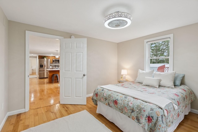 471 Methodist Rd, Westbrook, ME 04092 - bedroom with stainless steel fridge and light wood finished floors