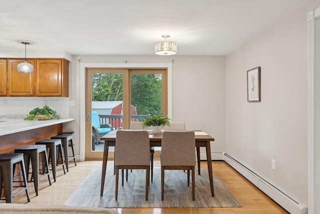 471 Methodist Rd, Westbrook, ME 04092 - dining area with baseboard heating and light wood-style floors