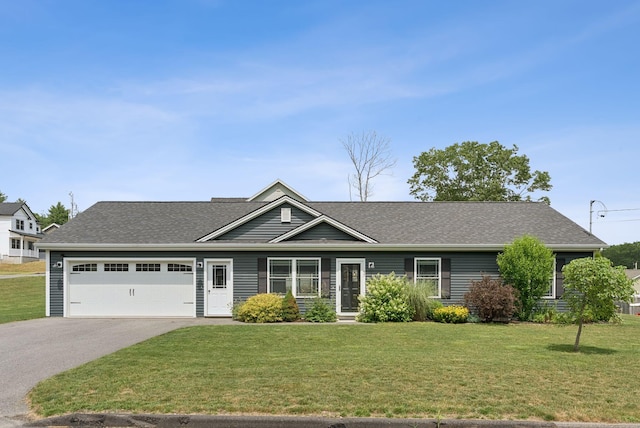 37 Homewood Blvd, Old Orchard Beach, ME 04064 - view of front facade with asphalt driveway, a front yard, an attached garage, and roof with shingles