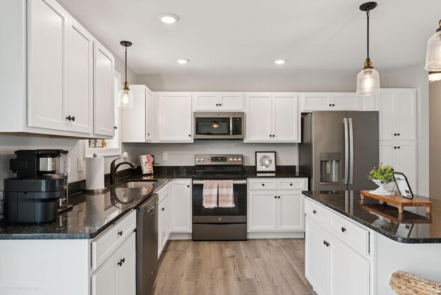 37 Homewood Blvd, Old Orchard Beach, ME 04064 - kitchen featuring stainless steel appliances, white cabinets, light wood finished floors, hanging light fixtures, and recessed lighting