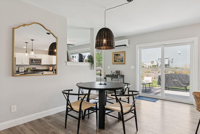 37 Homewood Blvd, Old Orchard Beach, ME 04064 - dining space featuring wood finished floors and an AC wall unit