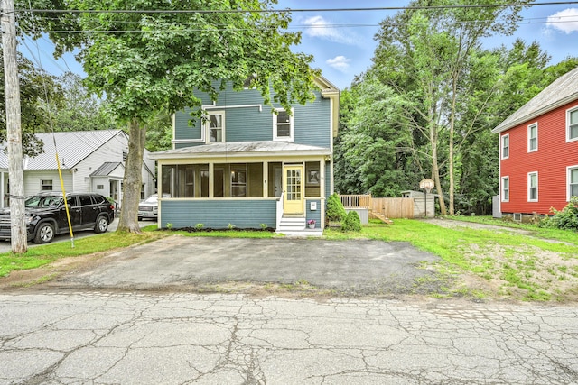 38 Silvermount St, Waterville, ME 04901 - traditional style home featuring a sunroom and a front yard