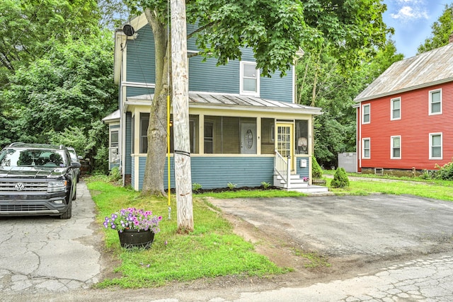 38 Silvermount St, Waterville, ME 04901 - view of front facade with a sunroom