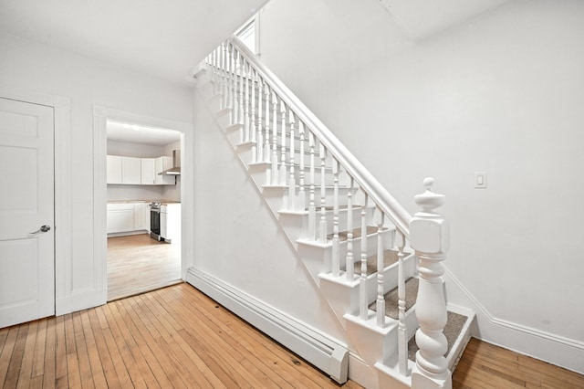 38 Silvermount St, Waterville, ME 04901 - stairs with baseboard heating and hardwood / wood-style floors