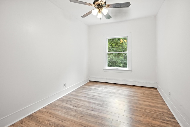 38 Silvermount St, Waterville, ME 04901 - unfurnished room featuring a baseboard radiator, wood finished floors, and ceiling fan