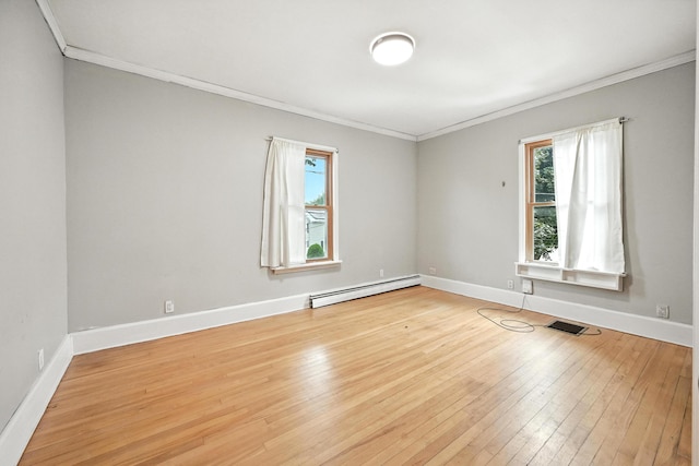 38 Silvermount St, Waterville, ME 04901 - unfurnished room featuring baseboard heating, ornamental molding, and wood-type flooring