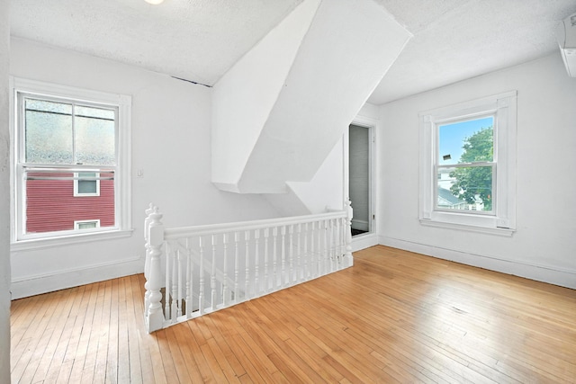 38 Silvermount St, Waterville, ME 04901 - additional living space with hardwood / wood-style flooring and a textured ceiling