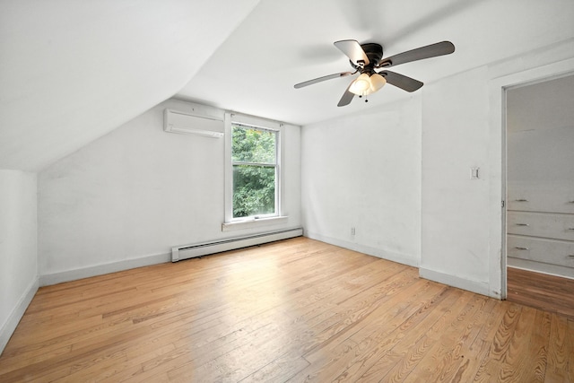 38 Silvermount St, Waterville, ME 04901 - bonus room featuring a baseboard radiator, a wall mounted AC, hardwood / wood-style floors, vaulted ceiling, and ceiling fan