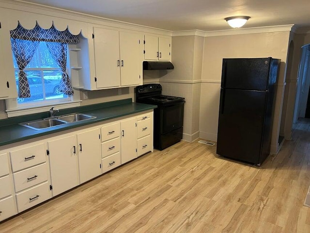 7 S Grove St, Waterville, ME 04901 - kitchen with black appliances, under cabinet range hood, dark countertops, white cabinetry, and crown molding