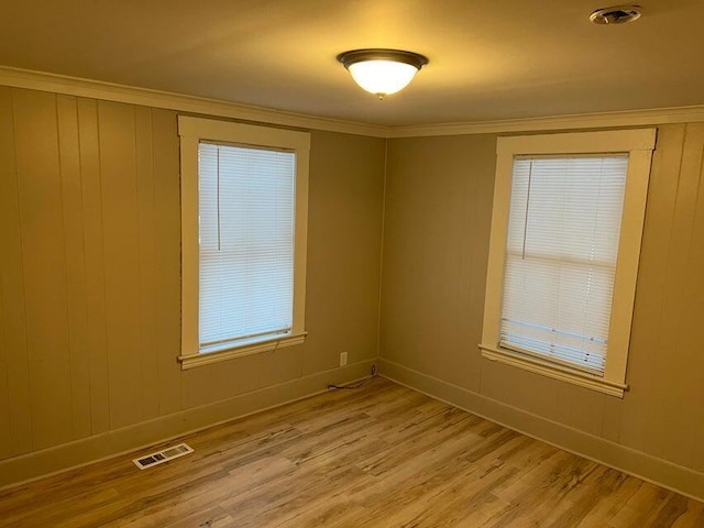 7 S Grove St, Waterville, ME 04901 - empty room with light wood-style flooring and crown molding