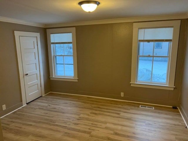 7 S Grove St, Waterville, ME 04901 - spare room with ornamental molding and light wood-style flooring