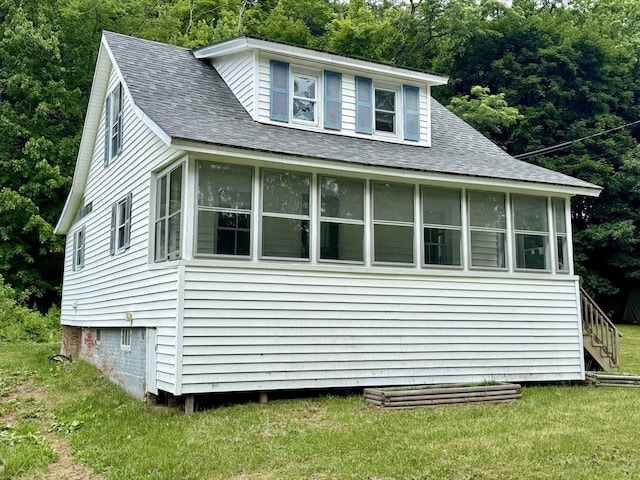 7 S Grove St, Waterville, ME 04901 - view of side of property with a sunroom, a shingled roof, a lawn, and stairs