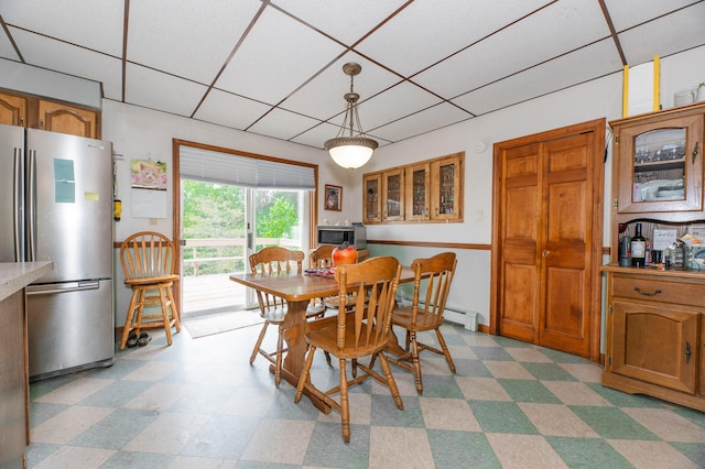 2887 Middle Rd, Sidney, ME 04330 - dining space with a drop ceiling, light flooring, and a baseboard radiator