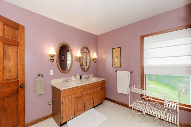 2887 Middle Rd, Sidney, ME 04330 - full bath with tile patterned floors and double vanity
