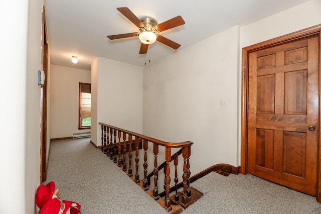 2887 Middle Rd, Sidney, ME 04330 - staircase with carpet floors, a baseboard heating unit, and ceiling fan