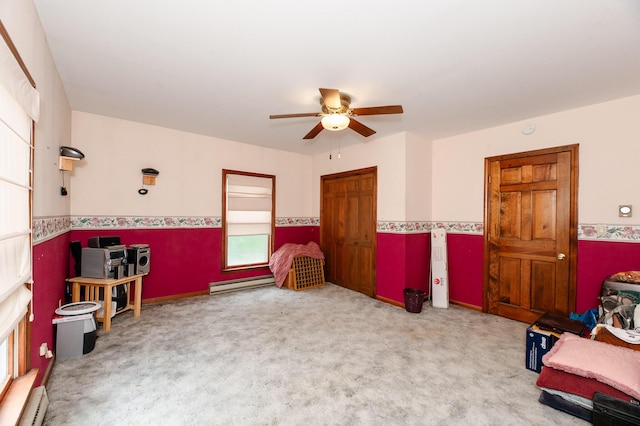 2887 Middle Rd, Sidney, ME 04330 - sitting room with a ceiling fan, a baseboard radiator, carpet flooring, and wainscoting