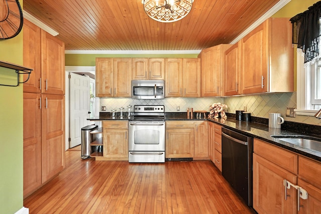 4 Hillcrest St, Waterville, ME 04901 - kitchen with stainless steel appliances, backsplash, crown molding, light wood finished floors, and dark stone counters