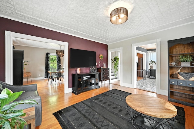 4 Hillcrest St, Waterville, ME 04901 - living room with wood finished floors, an ornate ceiling, and ornamental molding